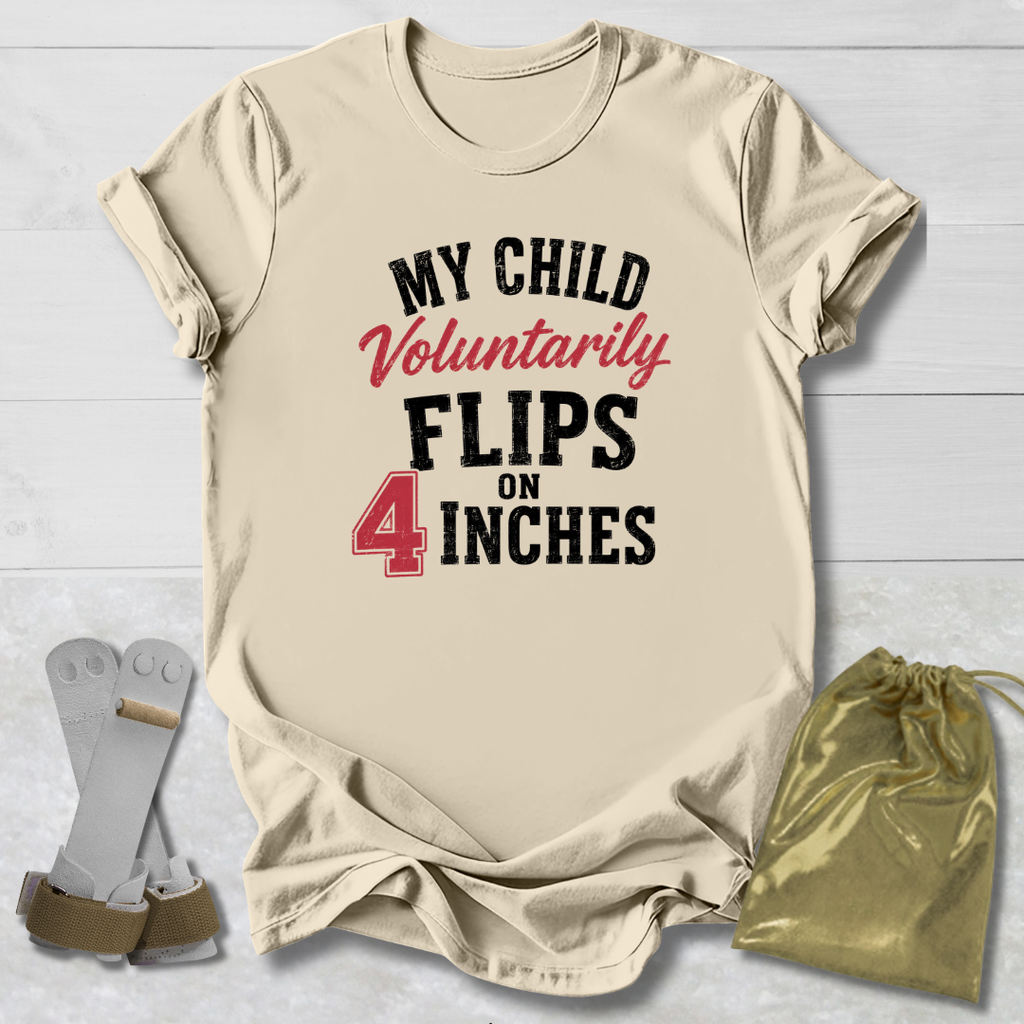 Beige t-shirt with humorous text, socks, and drawstring bag on a light wooden surface