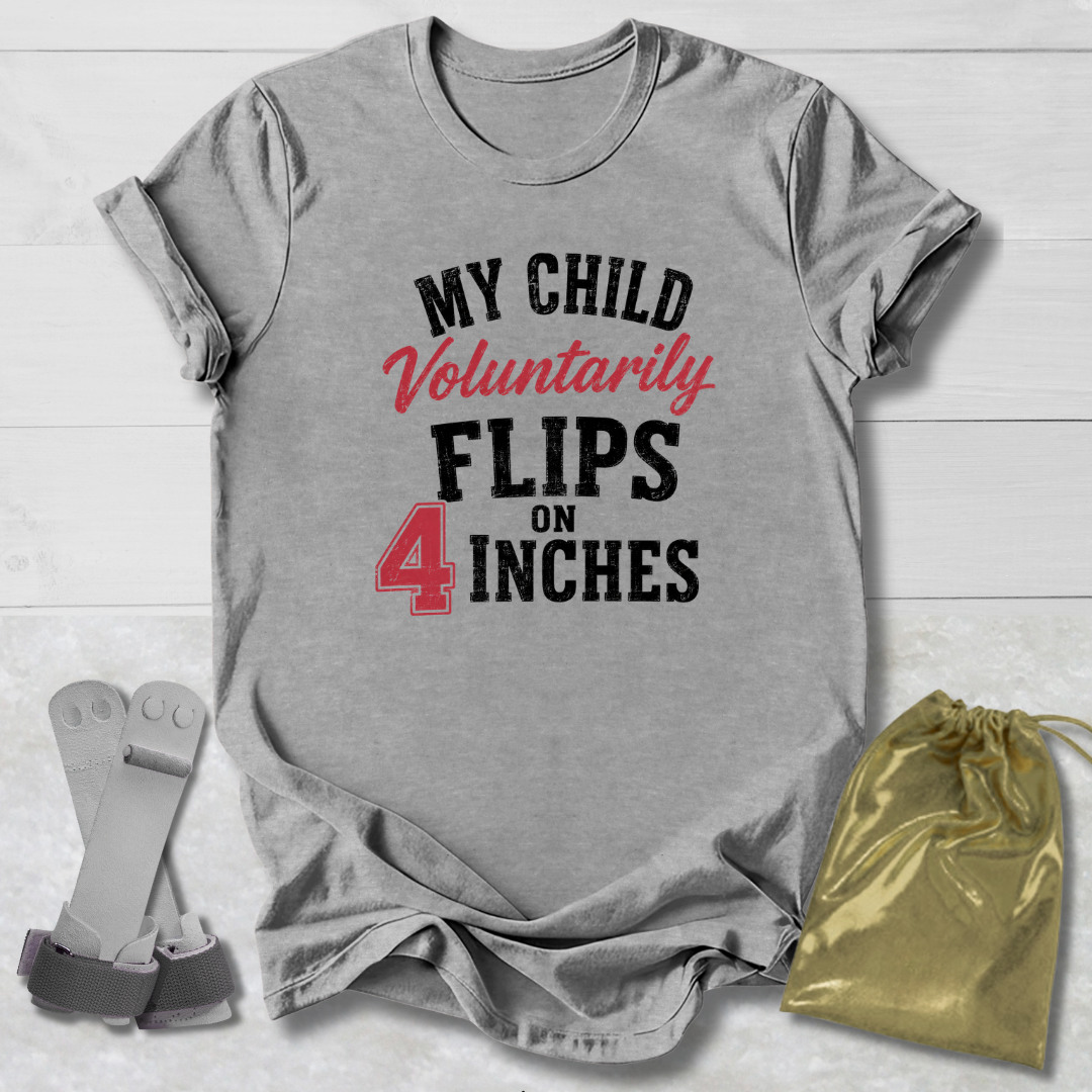 Gray t-shirt with humorous text design on a light wooden surface, accompanied by socks and a drawstring bag.