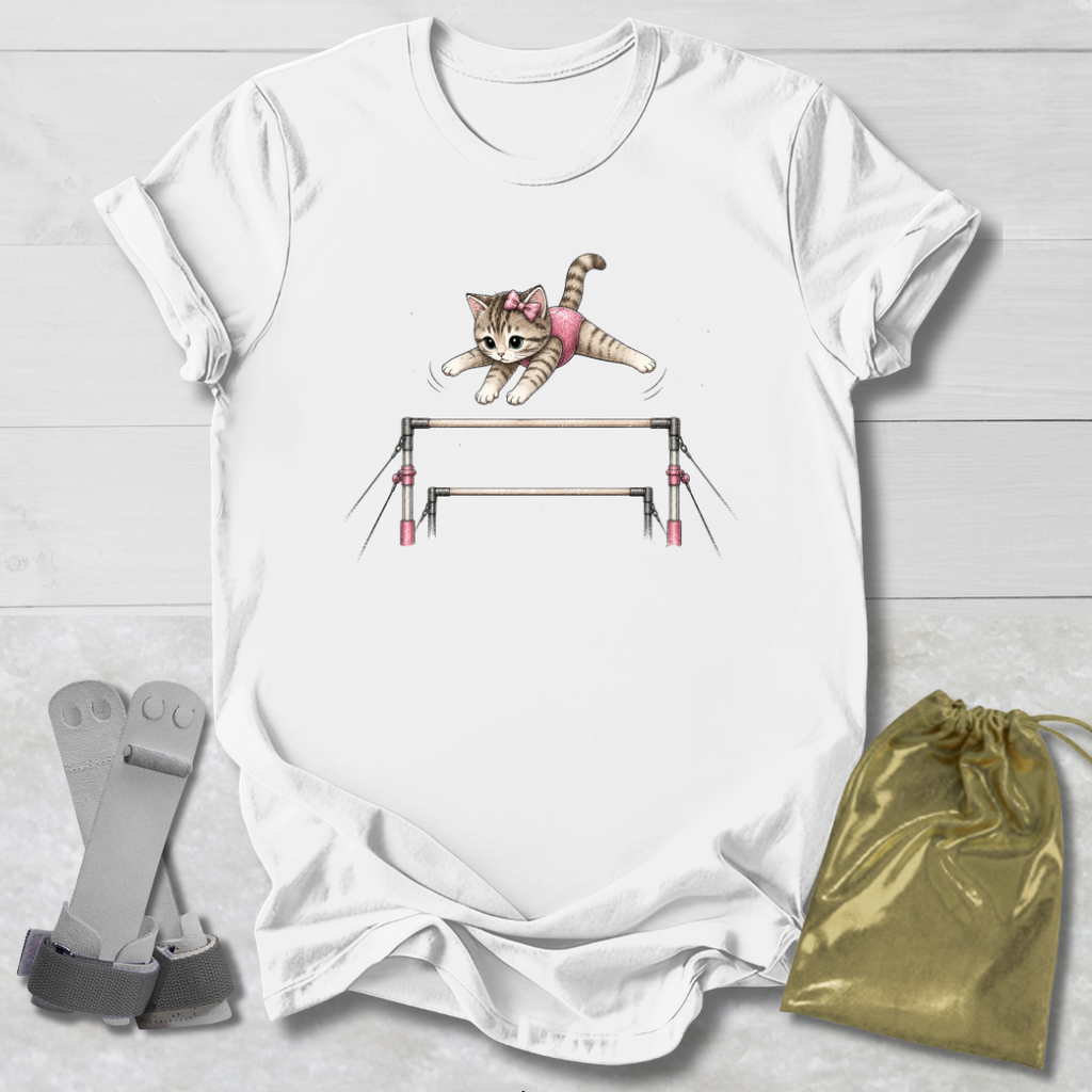 White t-shirt with a cat on balance beams graphic, socks, and a drawstring bag on a light wooden surface.