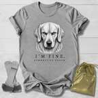 Gray t-shirt with a dog illustration and text, socks, and drawstring bag on a wooden surface