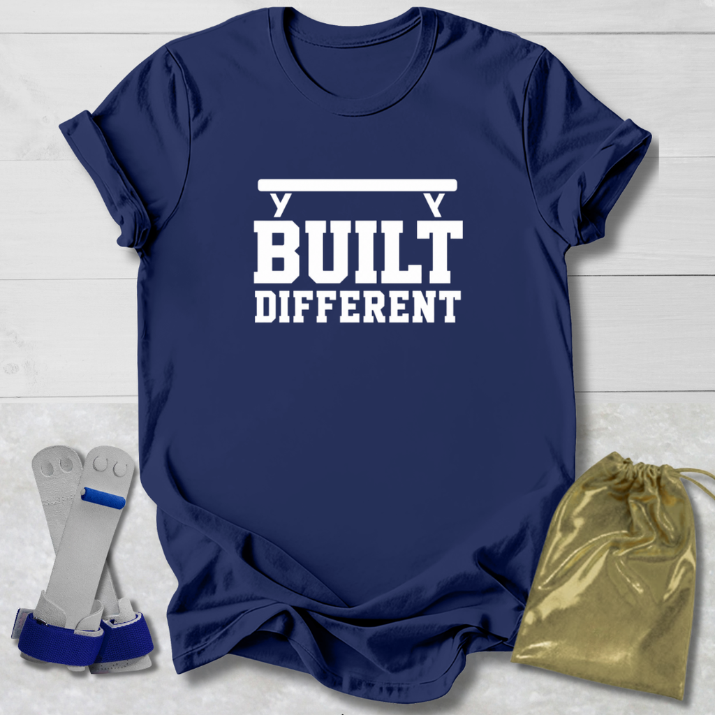 Navy blue t-shirt with 'It's a gymnast thing (you wouldn't understand)' text, socks, and drawstring bag on a light wooden surface.