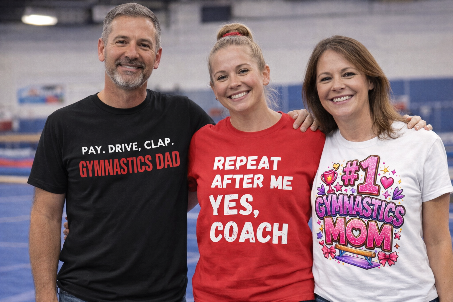 Three people wearing t-shirts with humorous gymnastics-themed text in an indoor sports facility.